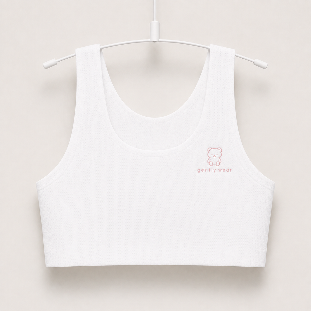 Gently first bra in white with embroidered bear logo, seamless wire-free longline crop on a hanger