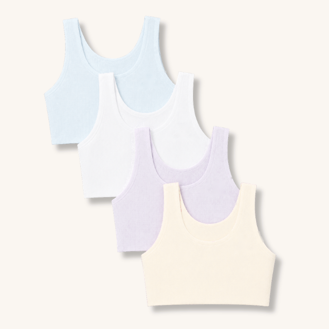 All four Gently first bra colours fanned out: ice blue, white, lilac and beige