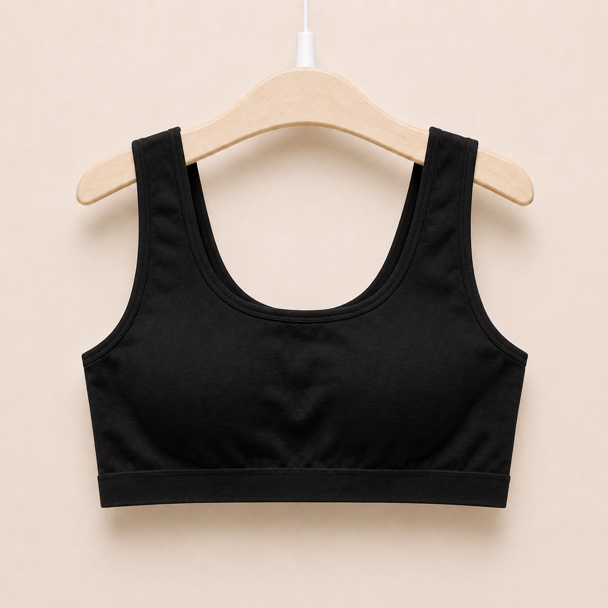 The Cotton One in black on a hanger - wire-free cotton training bra for girls