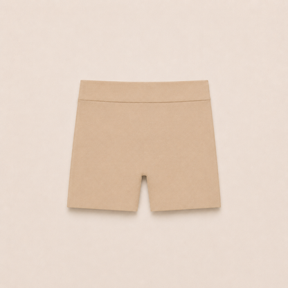 Gently Play Shorts in beige, seamless under-skirt shorts for girls, laid flat