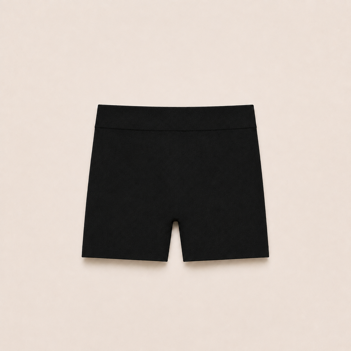 Gently Play Shorts in black, seamless under-skirt shorts for girls, laid flat