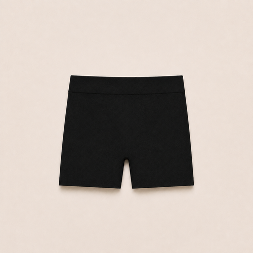 Gently Play Shorts in black, seamless under-skirt shorts for girls, laid flat
