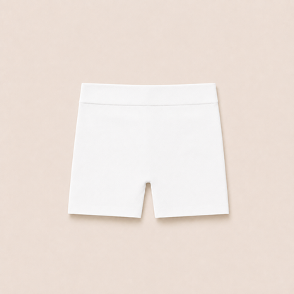 Gently Play Shorts in white, seamless under-skirt shorts for girls, laid flat
