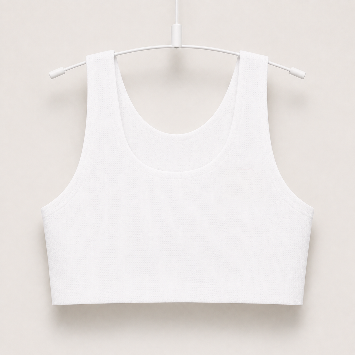Gently first bra in white, seamless wire-free longline crop on a hanger